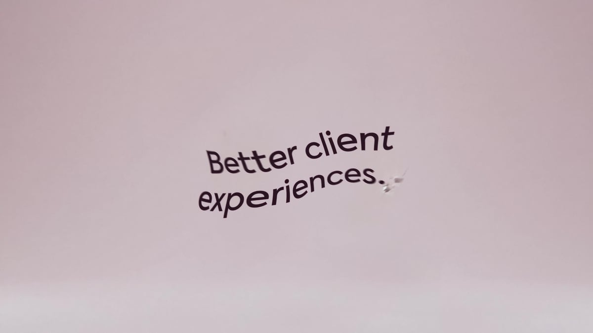 Better client experiences tagline set against a soft pink gradient in the Feathery video