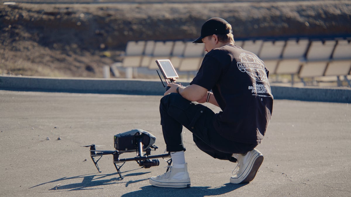 A man preparing the drone for a shoot.