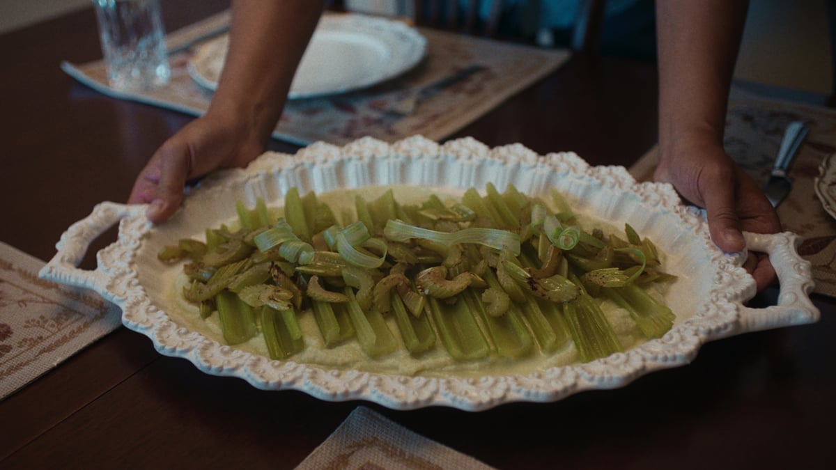 A delicious green dish served on a white platter, placed on the dining table.