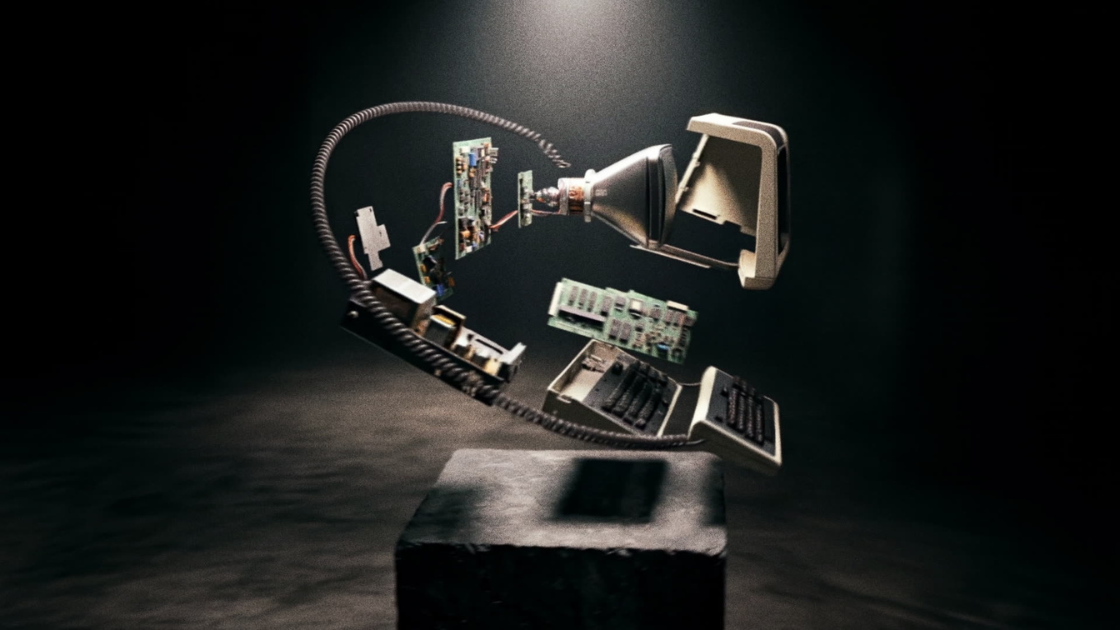 The exploded components orbit in zero-g above the empty plinth, each part rotating slowly in a choreographed exploded-view ballet under the lone spotlight.