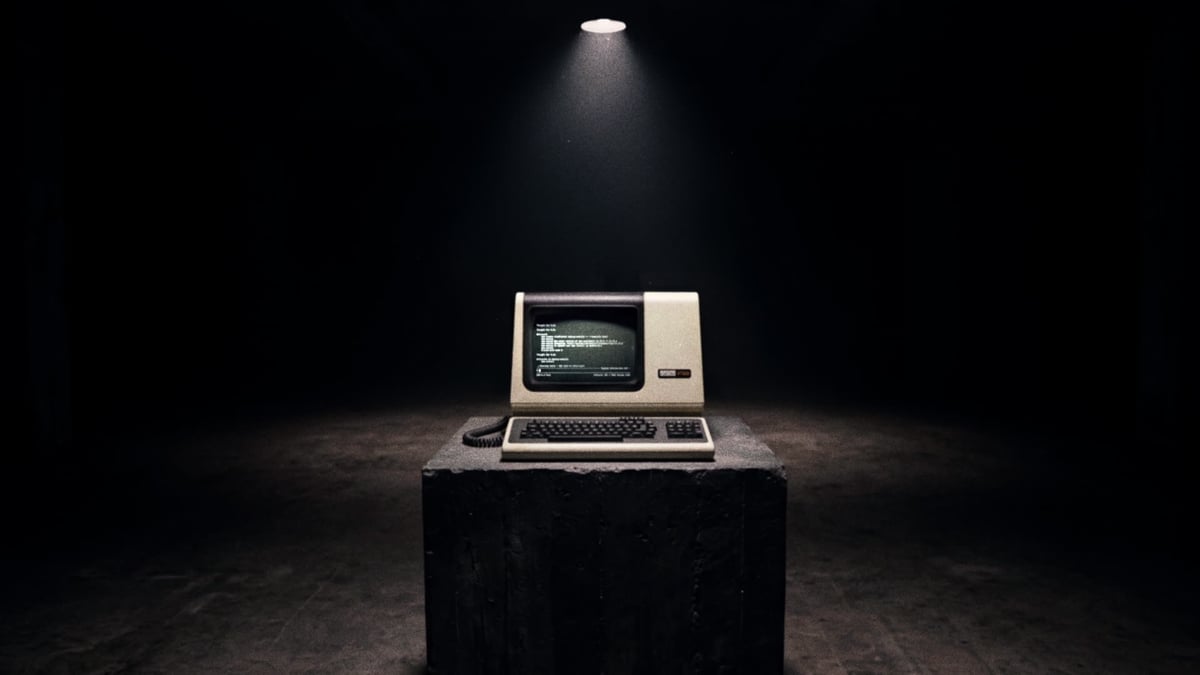 Tight push-in on the CRT as phosphor-green Devin output streams line-by-line across the screen, the machine alive with thinking.