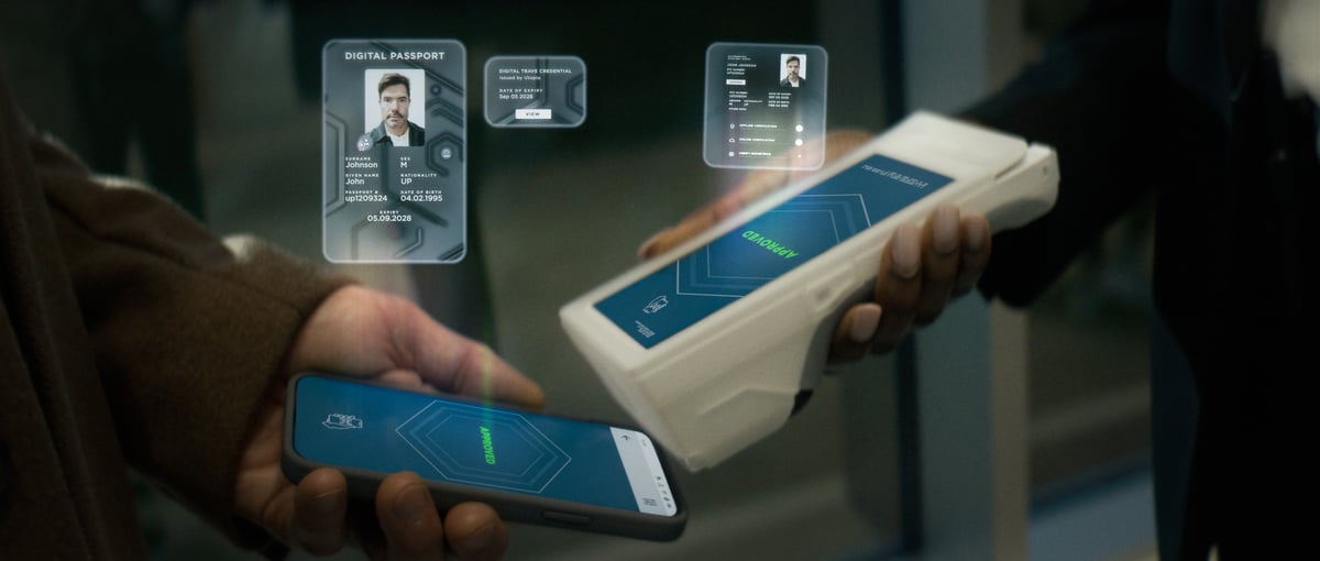 A mobile device being verified by the identity verification device, with holographic effects displayed for each device.
