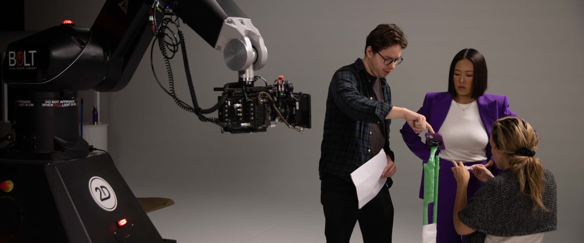 The director is giving instructions to the actress on the set