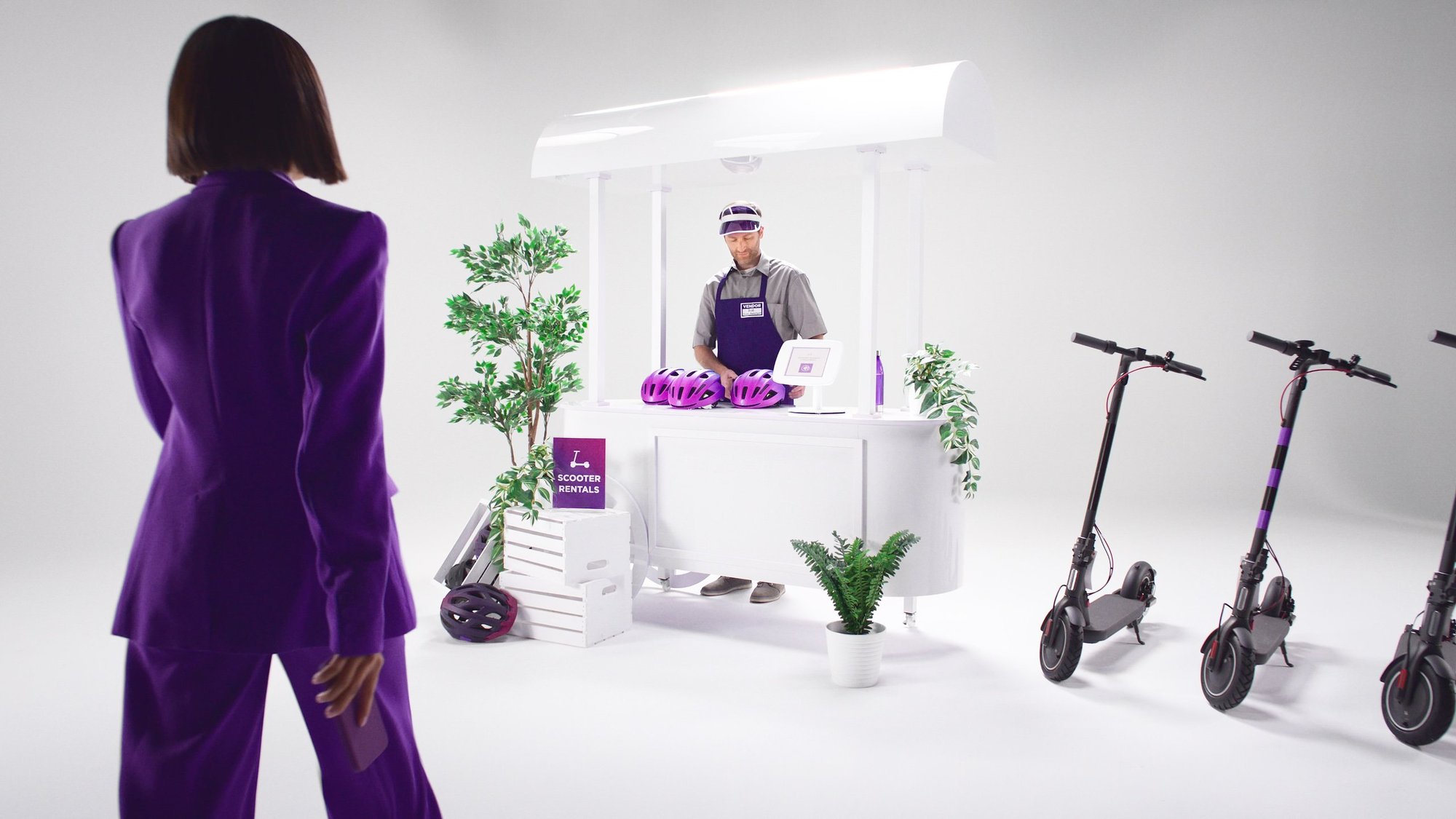The woman, dressed in a chic purple ensemble, stands by the ATM, patiently waiting for it to respond.