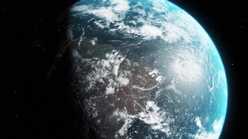 Close-up shot of Earth, capturing swirling clouds over water and landmasses.