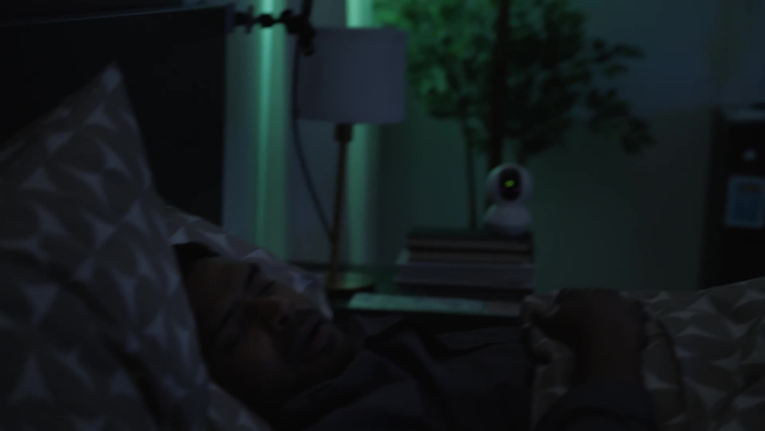 A close-up of a sleeper resting peacefully while a discreet night cam records, surrounded by the soft glow of IKEA’s homey setup.
