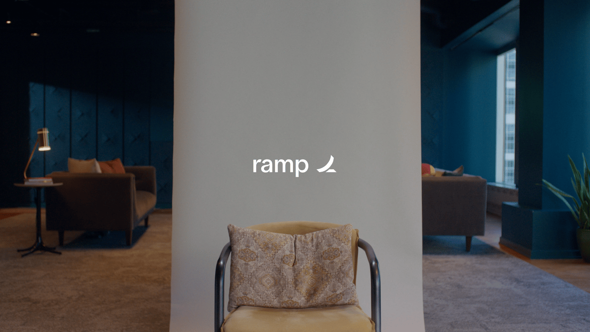 A production set featuring a chair with the Ramp logo text effect centered.