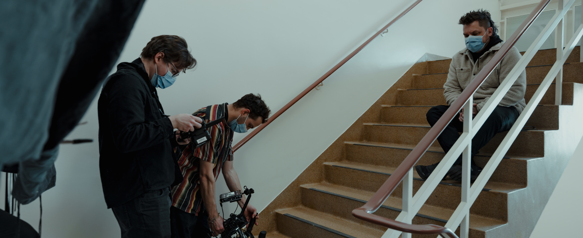 A scene taken in the staircase, with the father of the patient seated and deep in thought.