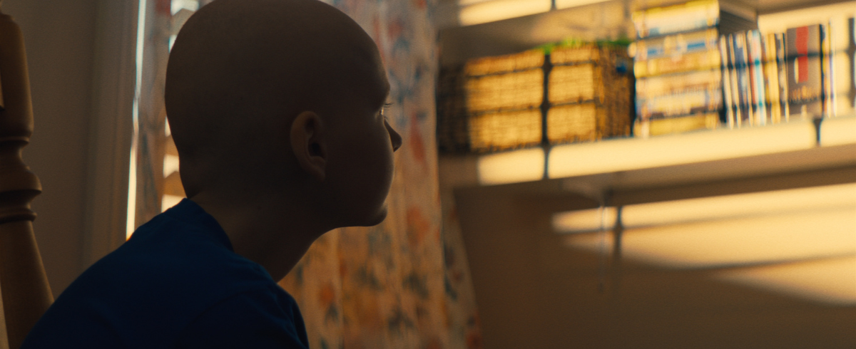 A leukemia patient looking into the distance.