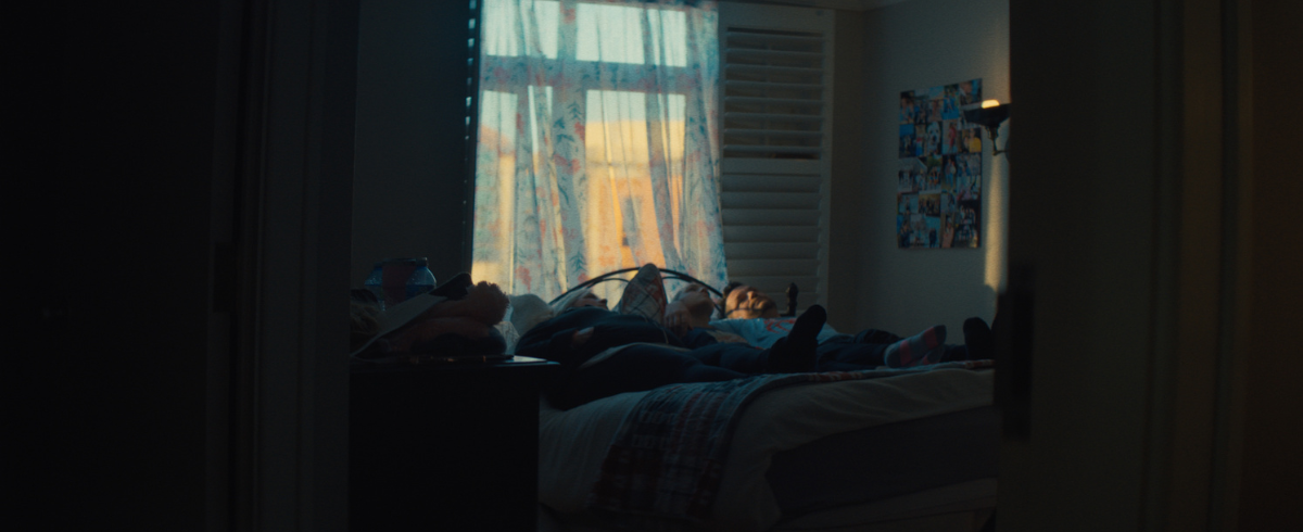 The family of the leukemia patient lying in bed together.