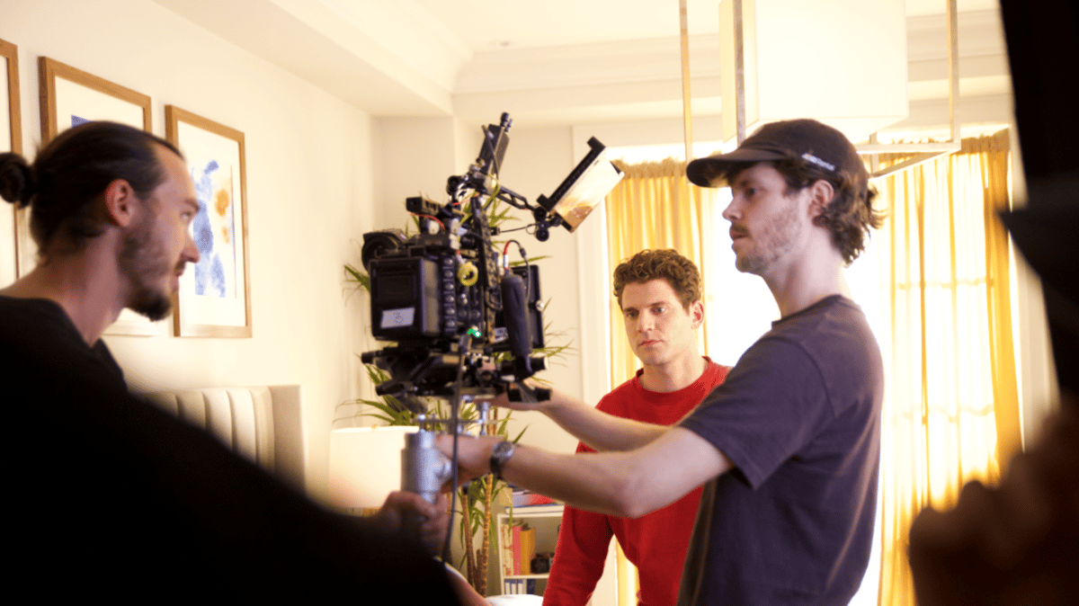 The production team engaged in a discussion while on set.