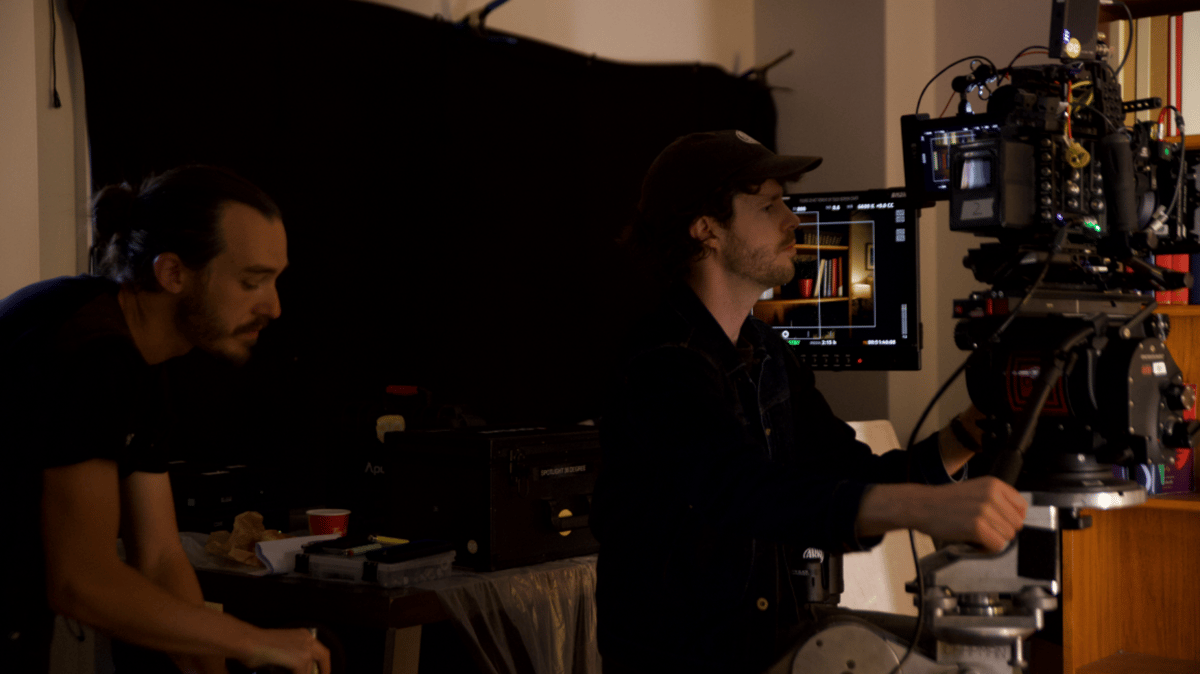 Videographer watching the screen during setup.