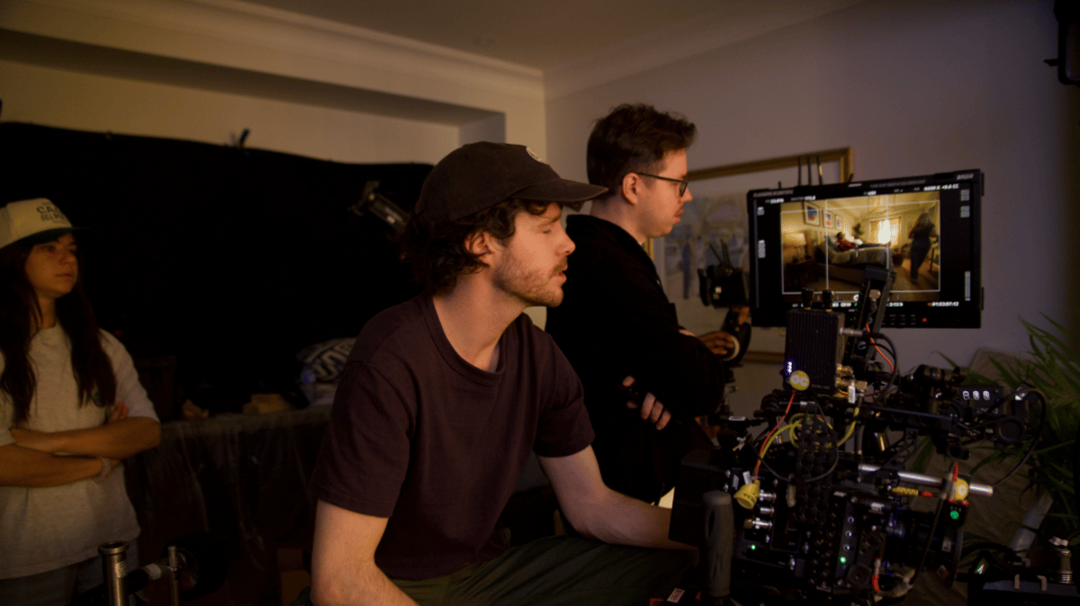 Videographer watching the screen during setup for a shot.