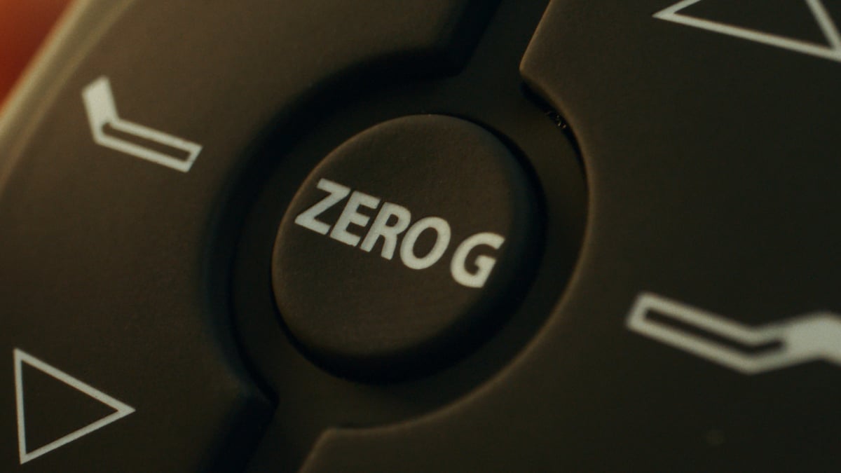 Close-up shot of a remote with a “Zero G” button.