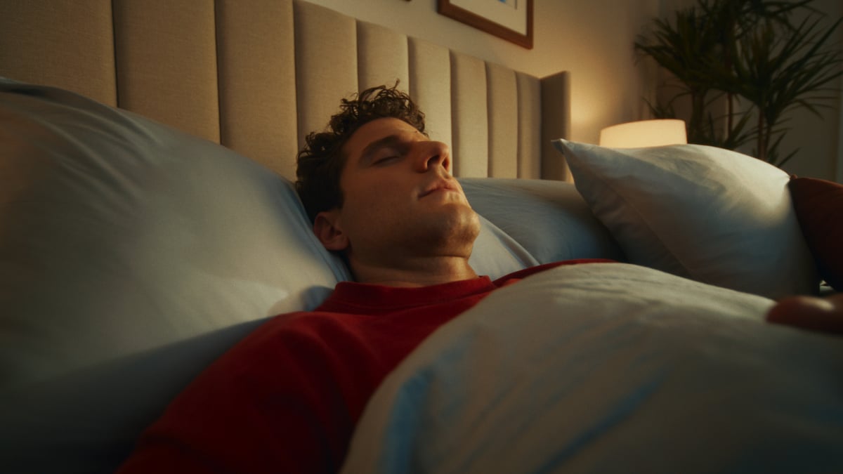 Man sleeping in complete relaxation.