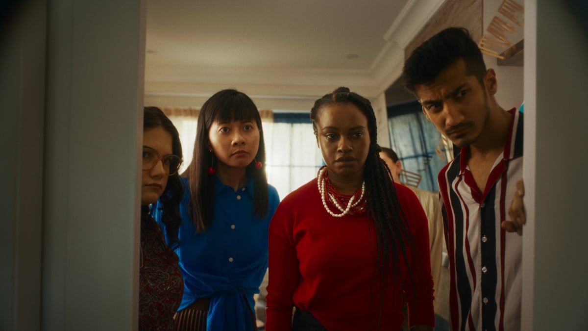 Group of people opening the door, looking judgmentally at the sleeping man.