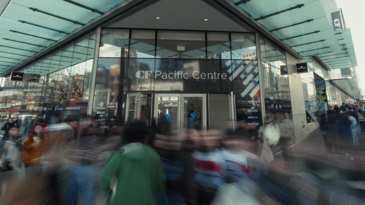 Time-lapse of shoppers moving through a bustling retail corridor at CF Pacific Centre