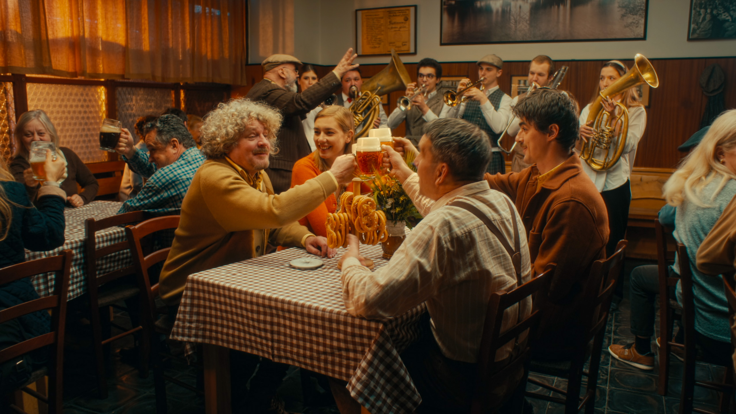 Friends sharing beer at a table.