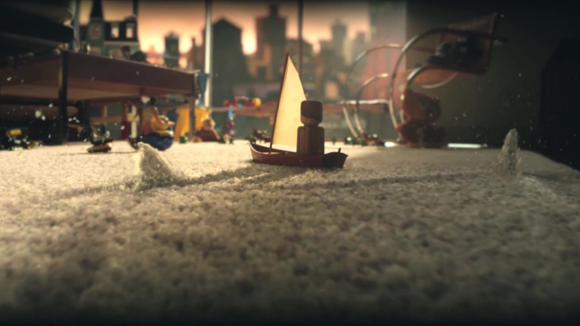 A toy sailboat glides across a carpet-turned-ocean in a child’s room, transforming imagination into an epic miniature adventure.