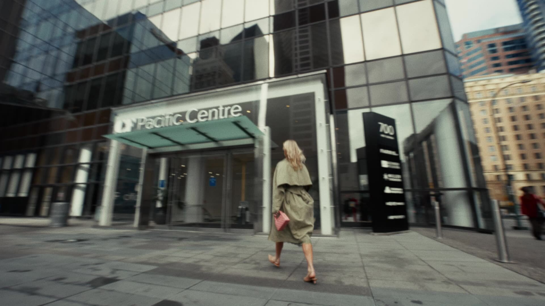 Low-angle exterior of the glass storefront entrance at CF Pacific Centre in downtown Vancouver